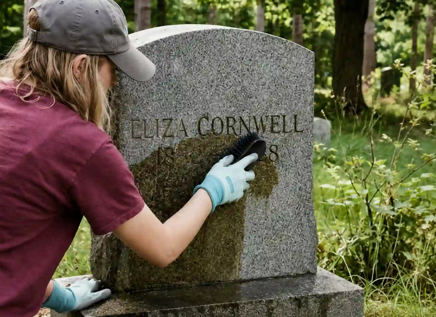 Low-pressure cleaning a weathered marble headstone